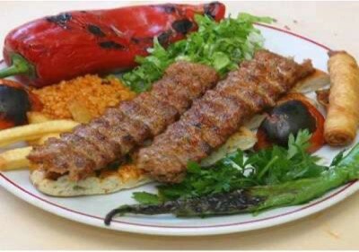 a plate of food with meat and vegetables